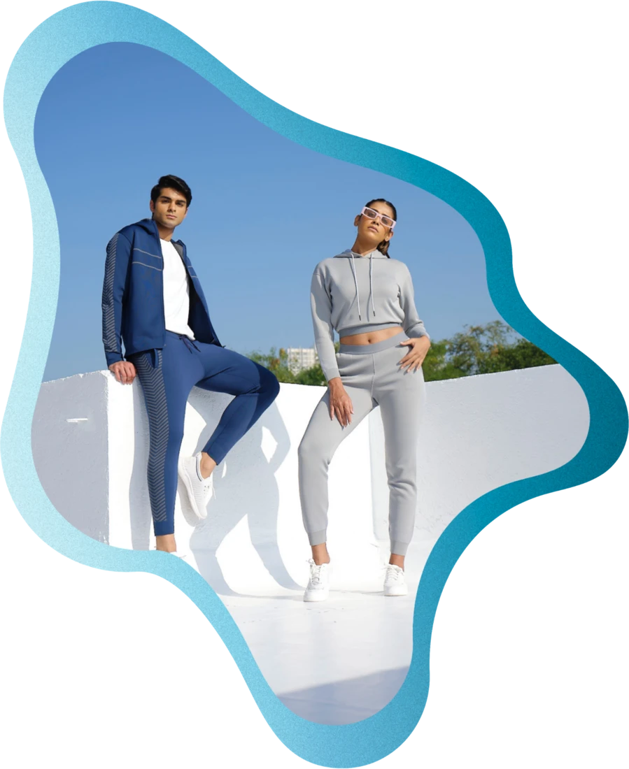Two people wearing MAS sustainable apparel on a rooftop