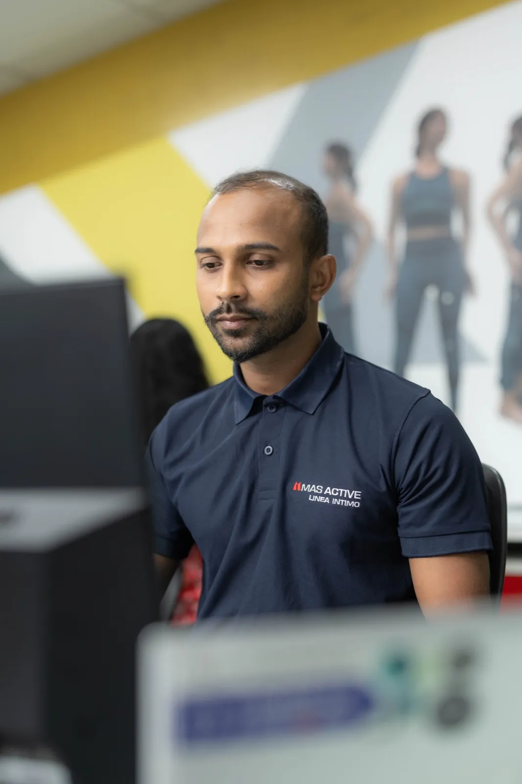 An MAS team member at work in a design office